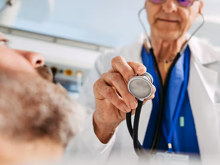 A doctor using a stethoscope.